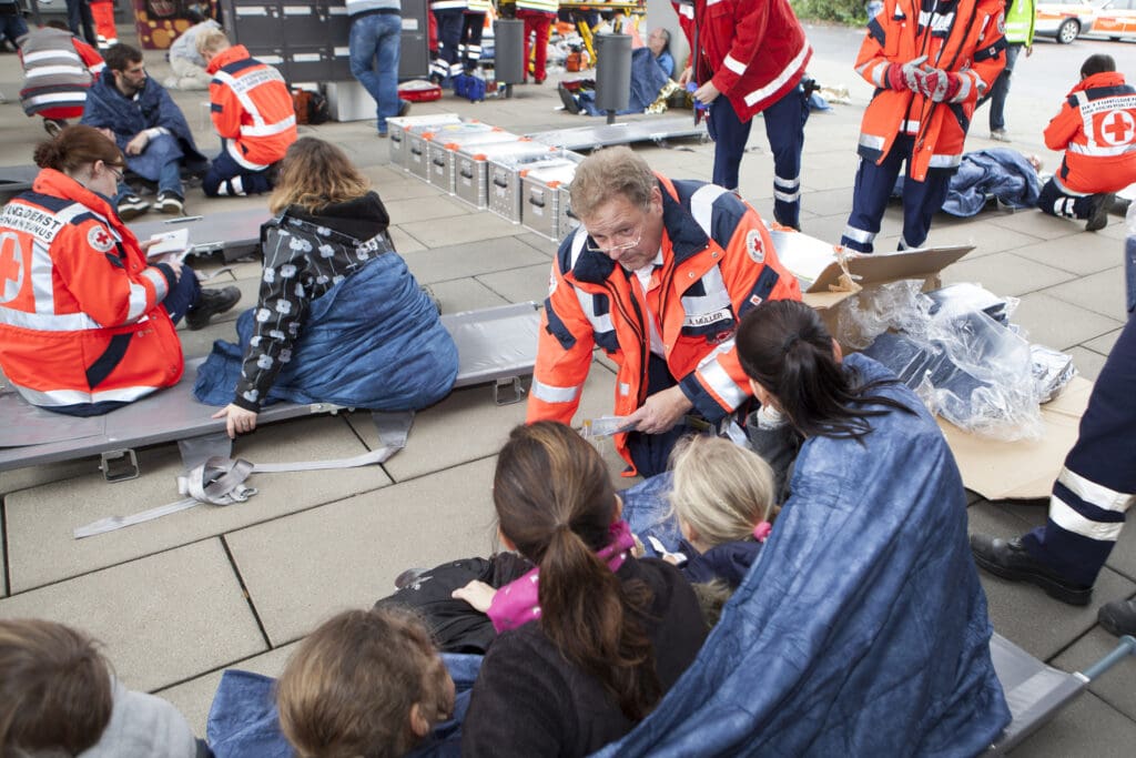 Emergency responders assisting people outdoors